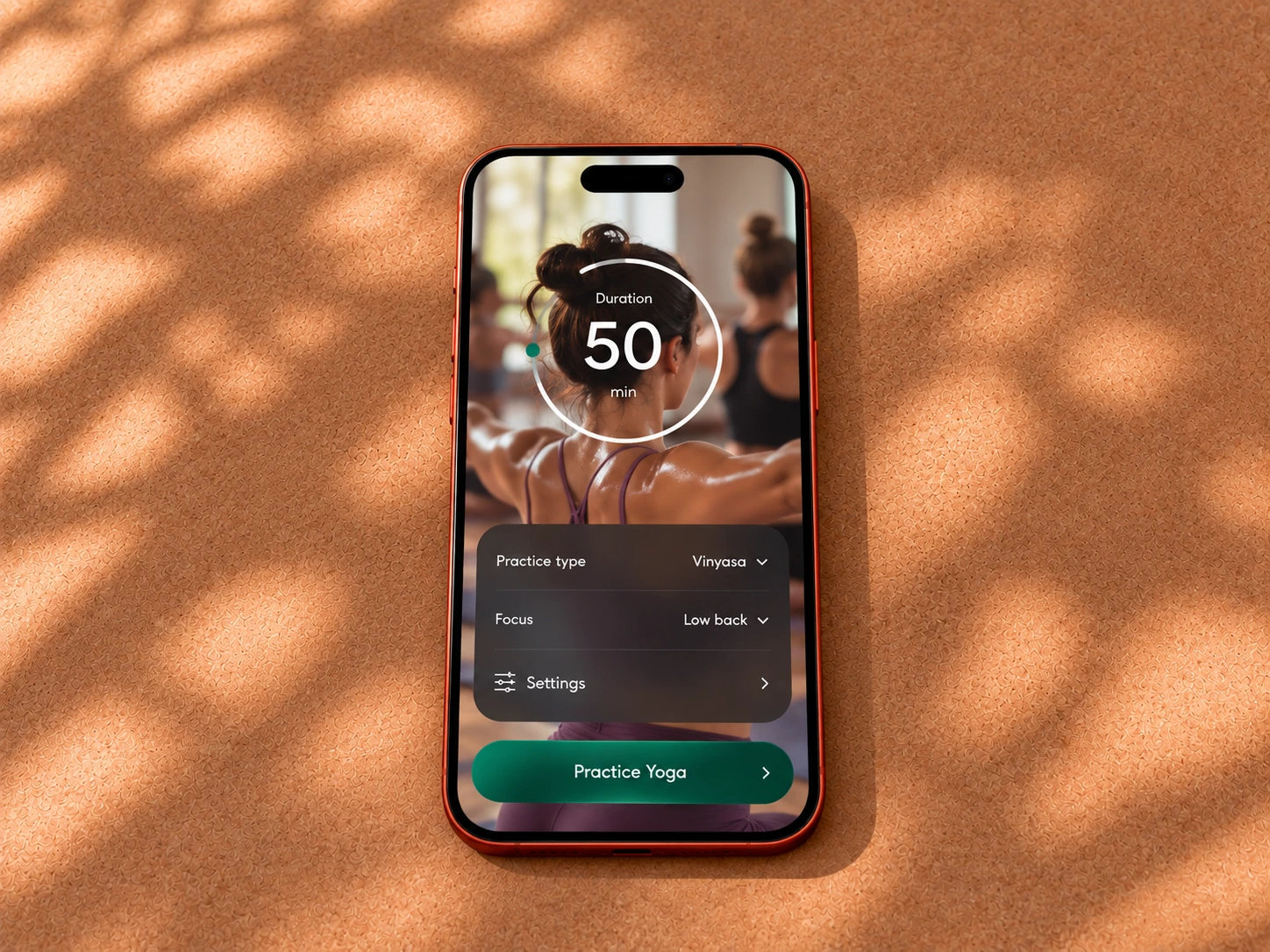 Yoga Space practice settings shown on a phone on a cork surface